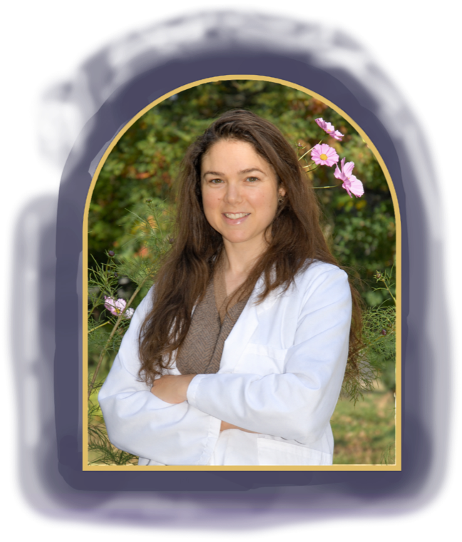 Belle Tenaglia smiling in a white coat, with pink cosmos flowers and greenery behind her